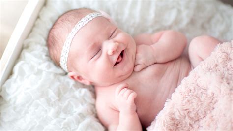 Smiley Cute Baby Is Sleeping On White Bed Wearing White Headband 4k 5k