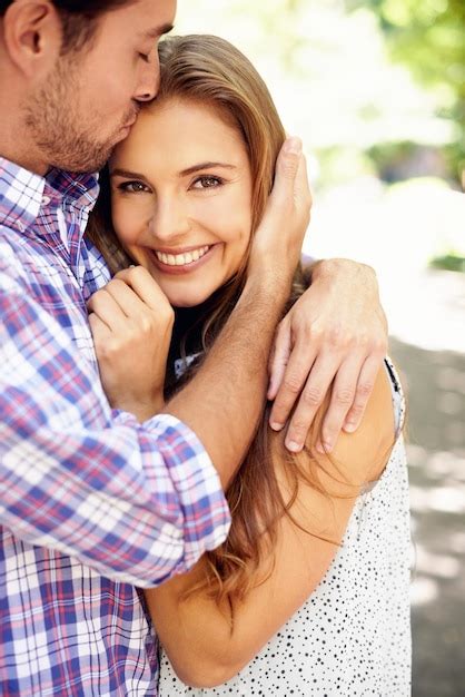 Premium Photo Couple Portrait Or Forehead Kiss Hug In Garden Nature Or Park On Valentines Day