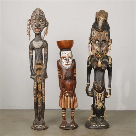 Lot A Group Of Three Polychrome Carved Wood Spirit Fertility And