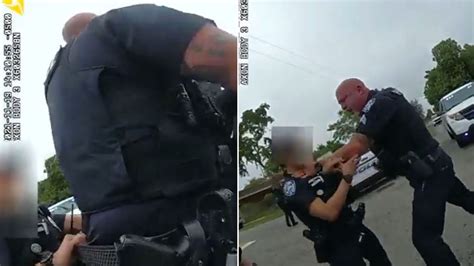 Cop Grabs Female Colleague By Throat After She Tries To Pull Him Off Suspect
