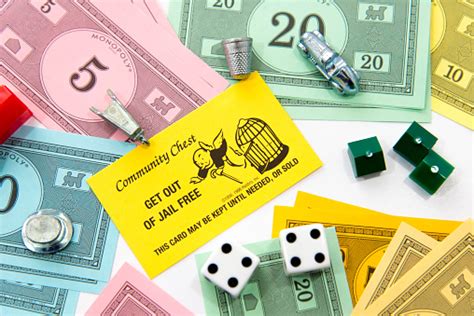Version of monopoly has two get out of jail free cards, with distinctive artwork. Monopoly Pieces And Get Out Of Jail Free Card Stock Photo - Download Image Now - iStock