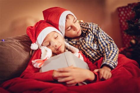 Premium Photo Cute Sister And Brother Sleeping Waiting Christmas Ts At Home