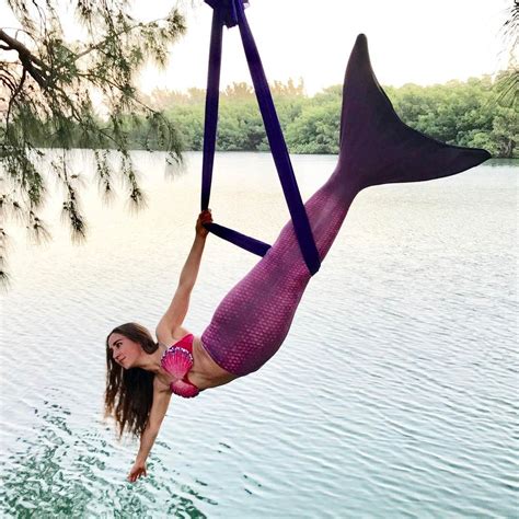 Mermaid Yogi Mermaid Jules poses in a yoga hammock ...