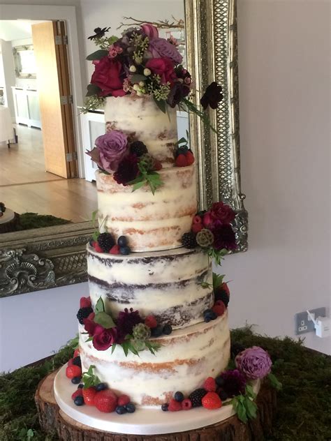Stunning Tier Semi Naked Wedding Cake Decorated With A Combination Of Fresh Flowers In Jewel