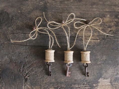 Set Of 3 Rustic Wood Spool Ornaments With Rusty Bells Skeleton Keys