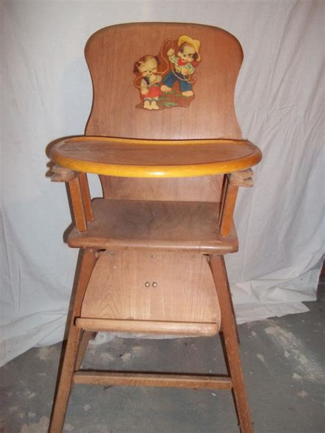 Portrait of caucasian 8 month old baby boy playing with toys sitting in high chair indoors. 101 best 1950s vintage high chair images on Pinterest ...