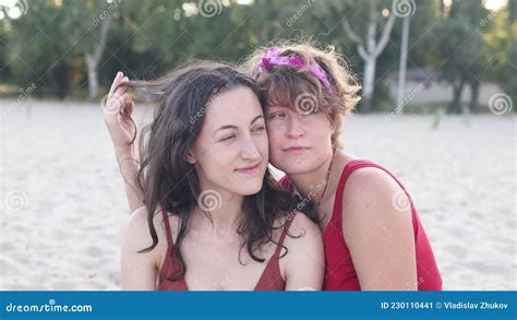 lesbian couple on the beach tenderness in the relationship of two