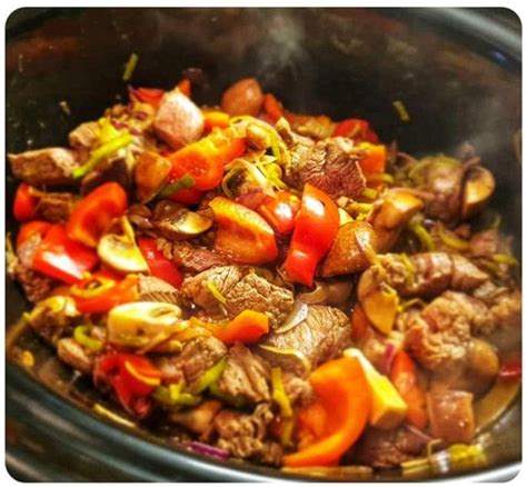 The Food Is Cooked And Ready To Be Eaten In The Crock Pot For Dinner