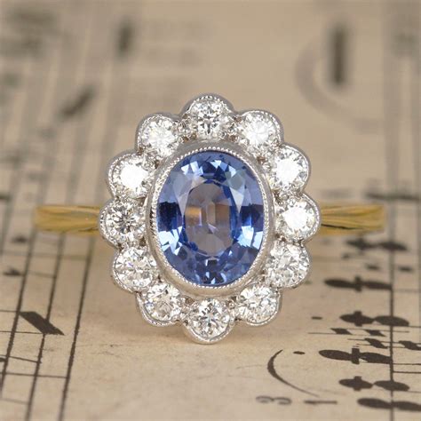 cornflower blue sapphire and diamond cluster ring holts jewellery