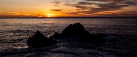 Download Wallpaper 2560x1080 Sea Rocks Horizon Sunset Dark Dual