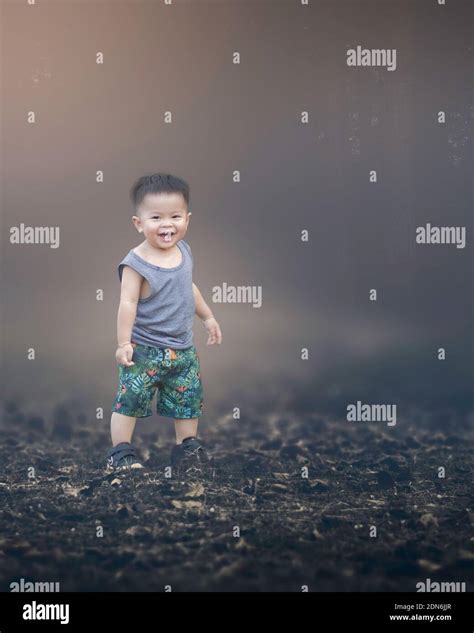 Portrait Of Cute Baby Boy Standing On Land Stock Photo Alamy