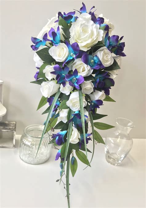 Photo by lauren fair photography. White rose galaxy blue purple orchids teardrop | Orchid ...