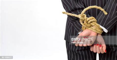Woman Hands Tied Behind Back Photos And Premium High Res Pictures