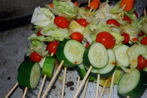 Cut each tomato into wedges, cutting down to about 1/2 inch of the bottom, without top with a tomato and spoon 1/2 cup of the chicken mixture into each tomato. Bake Your Heart Out: Dinner on a Stick