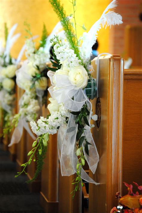 Choose from a variety of florists that offer the latest trends in bridal bouquets, wedding centerpieces and flower arrangements. Pew markers in all white Wedding Ceremony flowers by ...