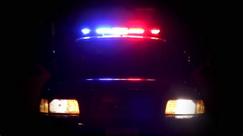 Shot Of Blurred Police Lights On Top Of A Patrol Car At Night Dv Ntsc Video Stock Footage Video