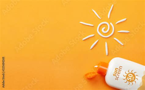 Sunscreen On Orange Background Plastic Bottle Of Sun Protection And