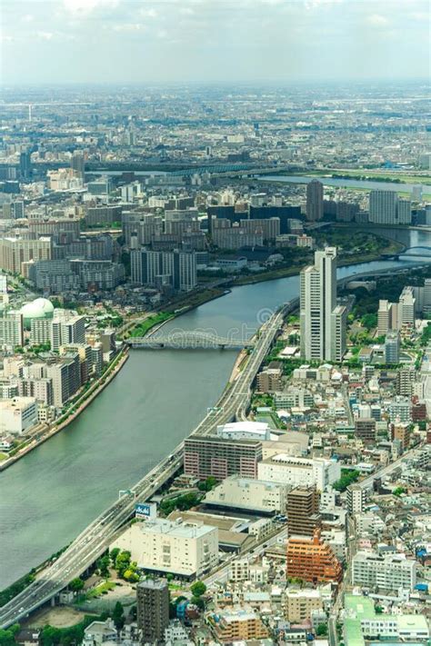 Aerial View Of Shinano River Flowing Through Tokyo Cityscape In Japan
