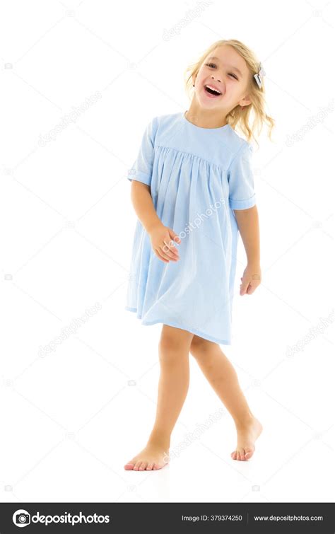 Charming Little Girl Laughing Happily In Studio Stock Photo By