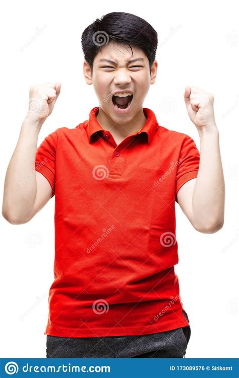 .Asian Boy Wearing A Red Shirt Shouting Loudly On A White BackgroundAsian Boy Wearing A Red 