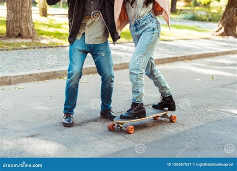 Cropped Image Of Boyfriend Helping His Girlfriend Stock Image Image