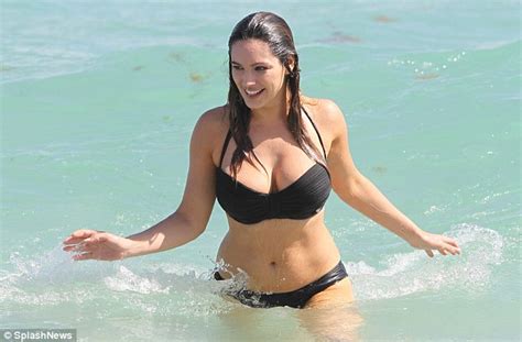 Kelly Brook Shows Off Her Assets In Black And White Bikinis As She