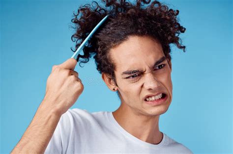 Problems With Combing Hair Young Guy In T Shirt And Combing Curls Model