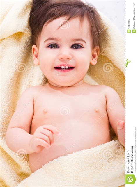 Cute Baby Smiling Covered In Yellow Towel Stock Image Image Of