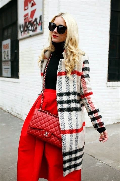 blair eadie wearing a plaid coat and a full red skirt click through for more fall fashion and