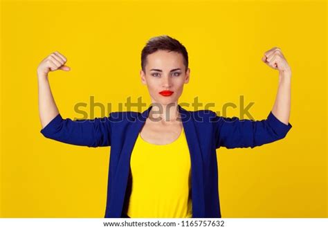 Powerful Confident Woman Flexing Her Muscles Stock Photo 1165757632