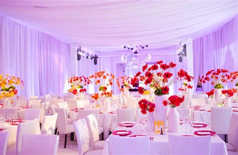 colorful wedding reception decor flowers lighting | OneWed.com