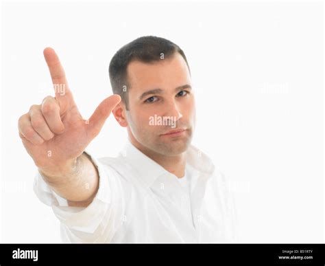 Portrait Of Man Holding Up Two Fingers Stock Photo Alamy