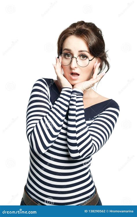 A Young Woman In A Striped Tight Sweater Wearing Round Glasses Makes A Regrettable Face Stock