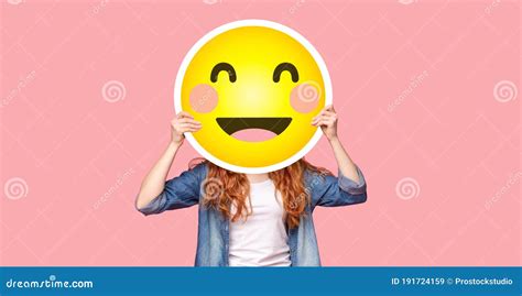 Redhead Girl Hiding Her Face Behind Happy Emoji Smile Stock Image