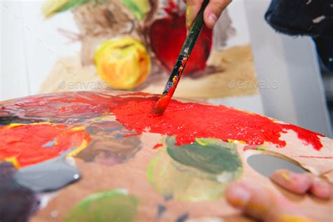 Close Up View Of Little Artist Holding Palette And Painting Stock Photo