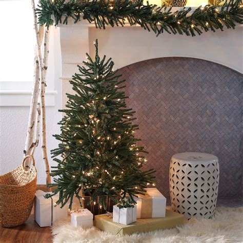 Put the branches and base together, then straighten out the tips. Finley Home 4 ft. Delicate Pine Slim Pre-Lit Christmas ...