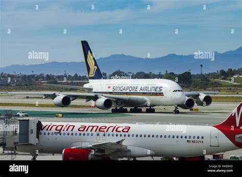 Virgin America A320 With Singapore Airlines A380 In The Background On