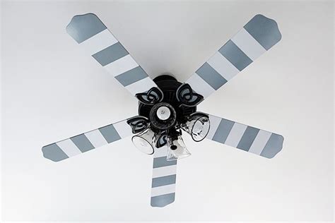 One white blade suffices the simplistic home. Ceiling fan with blades painted with white and blue stripes #diyproject #homedecor #rustoleum ...