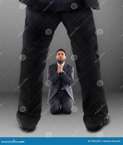 Man On His Knees Praying Not To Be Dismissed Stock Photography Image