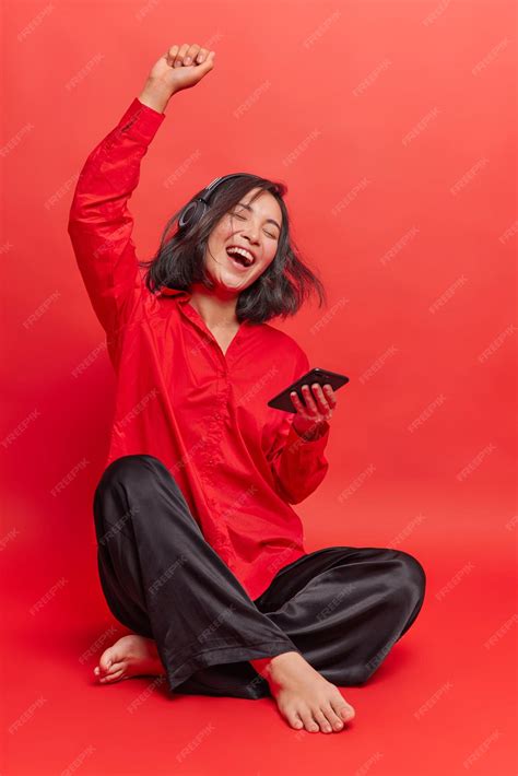 Free Photo Upbeat Positive Teenage Girl Enjoys Every Bit Of Music