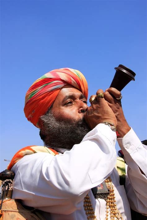 Indian Man Blowing Horn During Mr Desert Competition Jaisalmer India