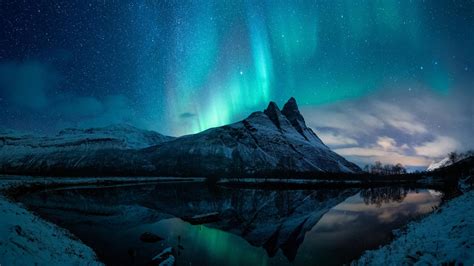 Snow Aurora Borealis Mountain During Nighttime With Reflection On Body