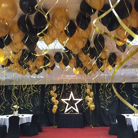 Black And Gold Balloon Ceiling Decoration With Gold Light Up Star By