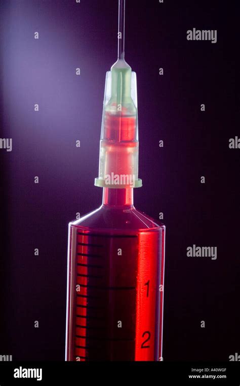 Blood Filled Syringe With Hypodermic Needle Black Background Stock