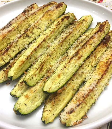 Fun, fast and easy to make yet delicious and crispy to eat! Baked Parmesan Garlic Zucchini Recipe - Melanie Cooks