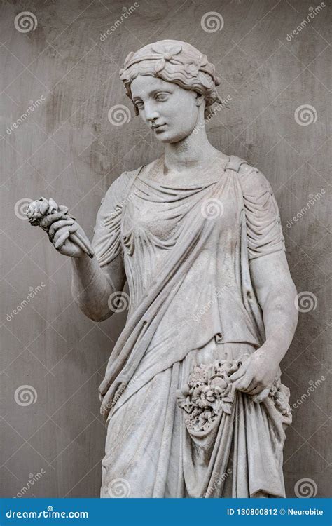 Ancient Statue Of Sensual Greek Renaissance Era Woman With A Flo Stock