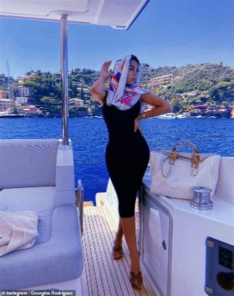 Georgina Rodriguez Puts On A Busty Display And Flaunts Her Derrière As She Basks In The Sun