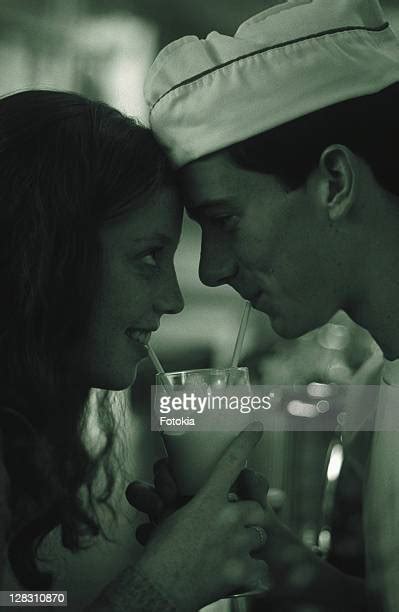 Teenage Couple Sharing Milkshake ストックフォトと画像 Getty Images