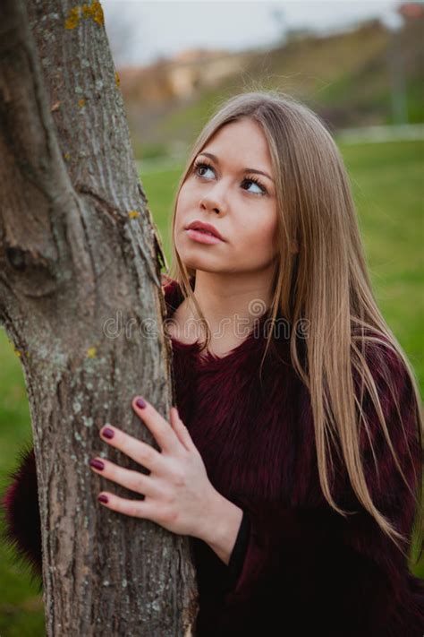 Portrait Blonde Girl Next To A Tree Trunk Stock Image Image Of Look