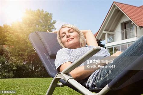 mature woman sunbathing photos and premium high res pictures getty images